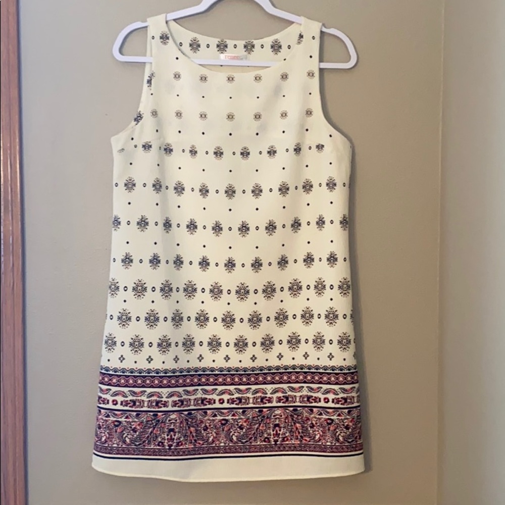 White dress with pattern, never worn